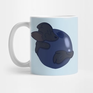 Sable Hugging a Blueberry Mug